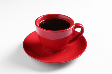 Red cup with aromatic coffee on white background