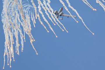 Very unusual view of a A-10 Thunderbolt II flying behind its flares
