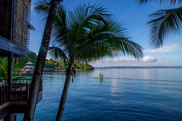 Beautiful resort in the Philippines. Local boat by the beach.