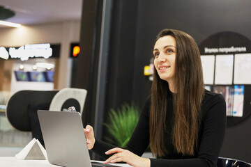 beautiful business woman in business center using tablet computer texting, walking in corporate office building, checking email messages online, successful executive woman.