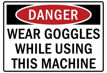 Safety equipment sign and labels wear goggles while using this machine