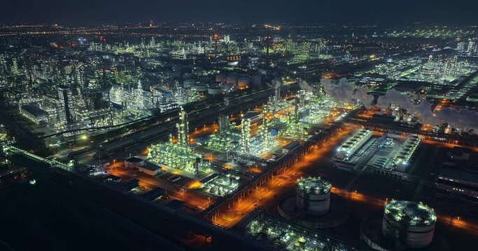 Aerial view of oil and gas petrochemical industrial with Refinery factory scene at night