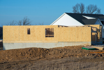 foundation and walls of a plywood house