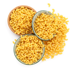 Bowls of raw elbow pasta isolated on white background