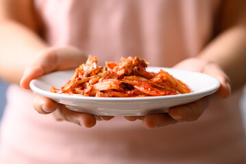 Kimchi cabbage with hand, Korean food homemade side dish