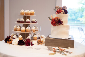 wedding cake and wedding cupcake tower, red velvet and vanilla, orange, brown, gold, and burgundy flowers