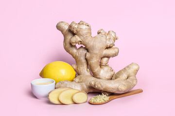 Fresh ginger roots, lemon, powder and slices on pink background