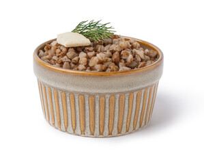 Bowl of tasty buckwheat porridge with butter and dill isolated on white background