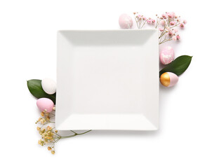 Composition with empty plate, Easter eggs and flowers on white background