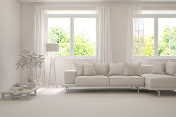 Fototapeta premium White living room with sofa and summer landscape in window. Scandinavian interior design. 3D illustration