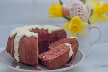 Freshly baked red velvet bundt cake on a table