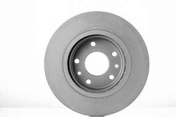close-up brake discs on a white background, spare parts 