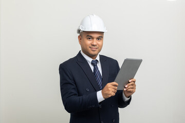 Businessman manager owner real estate working with digital tablet on isolated white background. Cooperation of architect designer. Engineer with safety helmet checking at working construction site