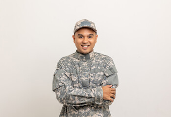 Asian man special forces soldier standing with arms crossed against on the field Mission. Commander...