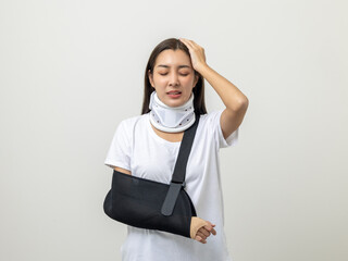 Depressed upset woman suffering from pain. Broken arm. Asian woman put on plaster bandage cast...