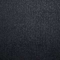Fototapeta premium The texture of the black plastic ribbed surface for background