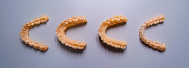 model of the lower jaw of the mouth guard. top view and flatly. geometric pattern like a line. high quality horizontal banner in dentist office. 