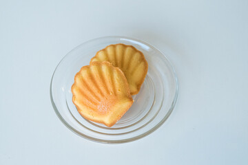 French madeleine cookies on plate,traditional French sweet dessert.