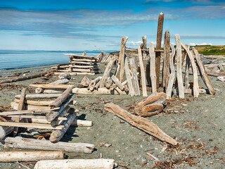 Three Beach Shelters Of Driftwood