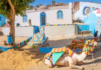 Aswan, Egypt; February 7, 2023 - Colourful Nubian houses in Aswan, Egypt. - obrazy, fototapety, plakaty