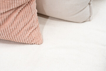 close up,home interior concept soft pillow arrange on king size white blanket mattress in bedroom with white curtain background home sweet home interior ideas