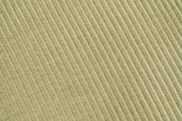 Green knitted woolen fabric texture for wallpaper and an abstract background.