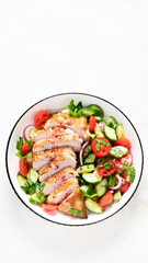 Salad with chicken meat. Fresh vegetable salad with chicken breast. Meat salad with chicken fillet and fresh vegetables on plate.