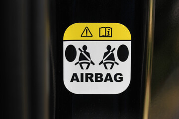 Airbag warning label in a new vehicle  - obrazy, fototapety, plakaty