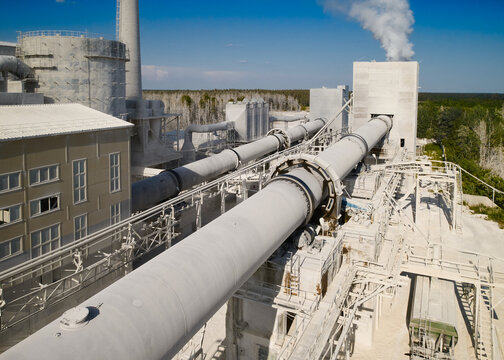 Lime burning kiln with rising steam at production plant