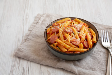 Homemade One-pot Hot Dog Pasta in a Bowl, side view. Space for text.