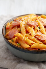Homemade One-pot Hot Dog Pasta in a Bowl, side view. Close-up.
