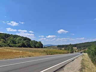 Summer landscape with road in the mountains