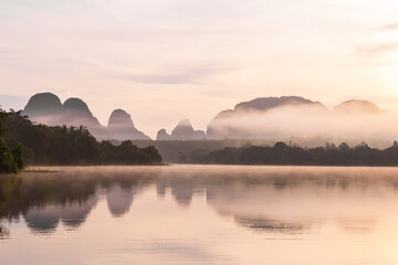 The Ban Nong Thale the natural scenery of the sunshine in the morning (mountains, lakes, trees, fog) at Krabi, Thailand.