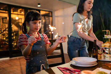 Multi-ethnic big family having fun, enjoy party outdoors in the garden.