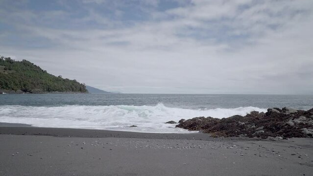 grey volcanic beach close to Chaiten in Patagonia