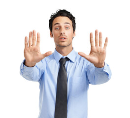 A stern young caucasian businessman giving a stop gesture with his both hands isolated on a png background.