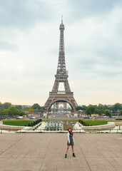 Beautiful young woman visiting paris and the eiffel tower