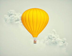 Hot air balloon flying above clouds.