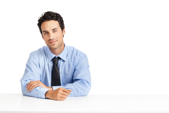 A handsome smiling businessman sitting and posing with his hands crossed on the table and looking at the camera or a copy space isolated on a png background
