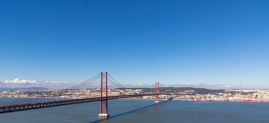 Fototapeta premium The 25 April bridge over the Tagus river in Portugal