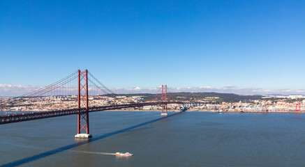 Landscape of the April 25 bridge over the Tagus river and the Lisbon  city  in the background