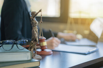 Legal and law concept. Statue of Lady Justice with scales of justice and wooden judge gavel on...
