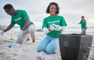 Volunteer group, beach clean and recycling plastic bottle for community service, pollution and earth day. Black woman and man ngo team cleaning sand for climate change, nature and helping environment - obrazy, fototapety, plakaty