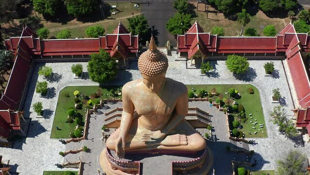 Aerial view of Wat Pikul Thong Phra Aram Luang or Wat Luang Por Pae temple with giant Buddha, in Sing Buri, Thailand