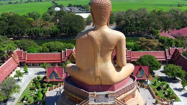 Aerial view of Wat Pikul Thong Phra Aram Luang or Wat Luang Por Pae temple with giant Buddha, in Sing Buri, Thailand
