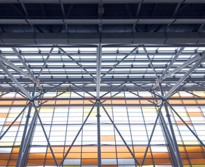 Fototapeta premium Lights and ventilation system in long line on ceiling of the industrial building. Exhibition Hall. Ceiling factory construction