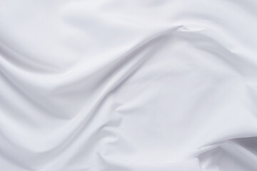 White fabric. luxurious white fabric texture background. Creases of satin, silk and cotton.