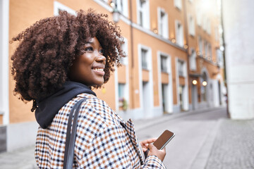 Travel, smile and black woman in street with phone, holiday sightseeing in London, happy tourist...