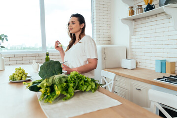 Woman preparing a salad in the kitchen