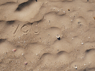 Fototapeta na wymiar You. Motivational inspirational message concept written on the sand of beach